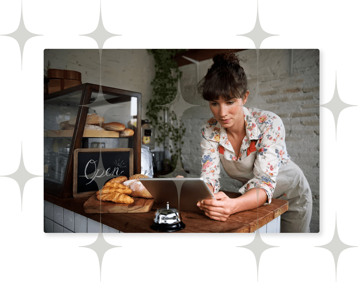 A small business owner working at her bakery counter.