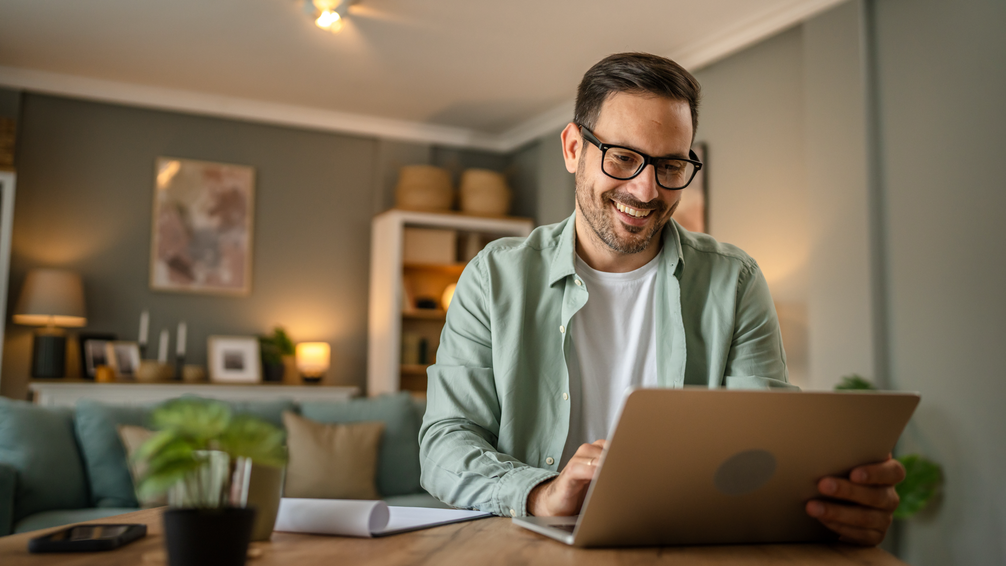 A small business owner working on their laptop